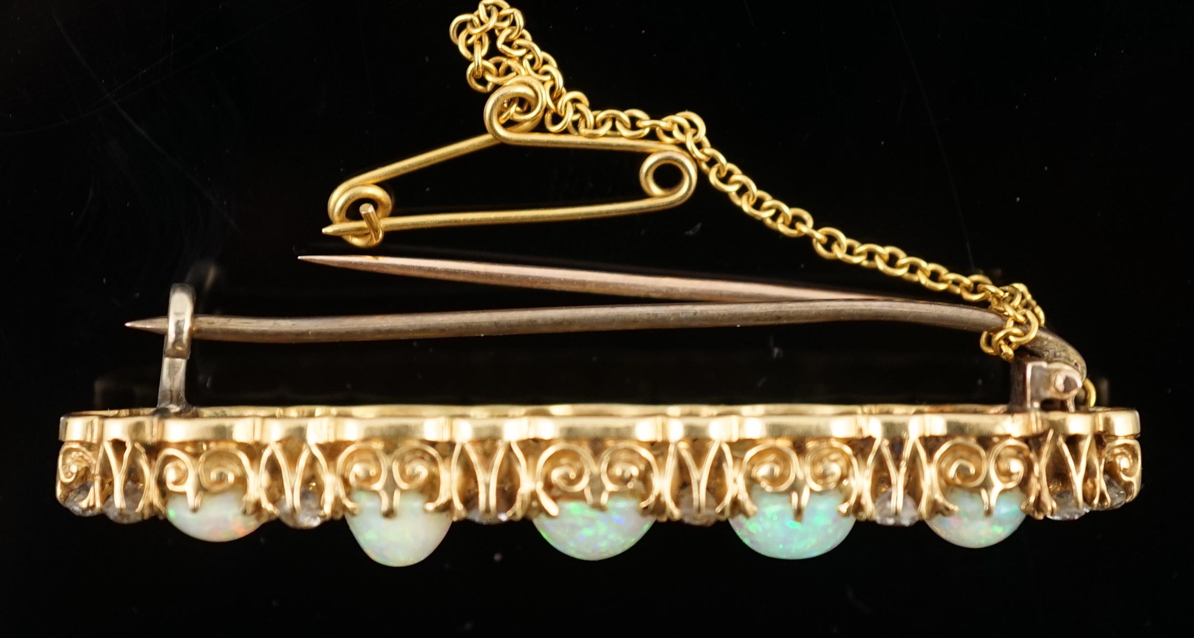 An early 20th century gold, diamond and oval white opal cluster set clip bar brooch